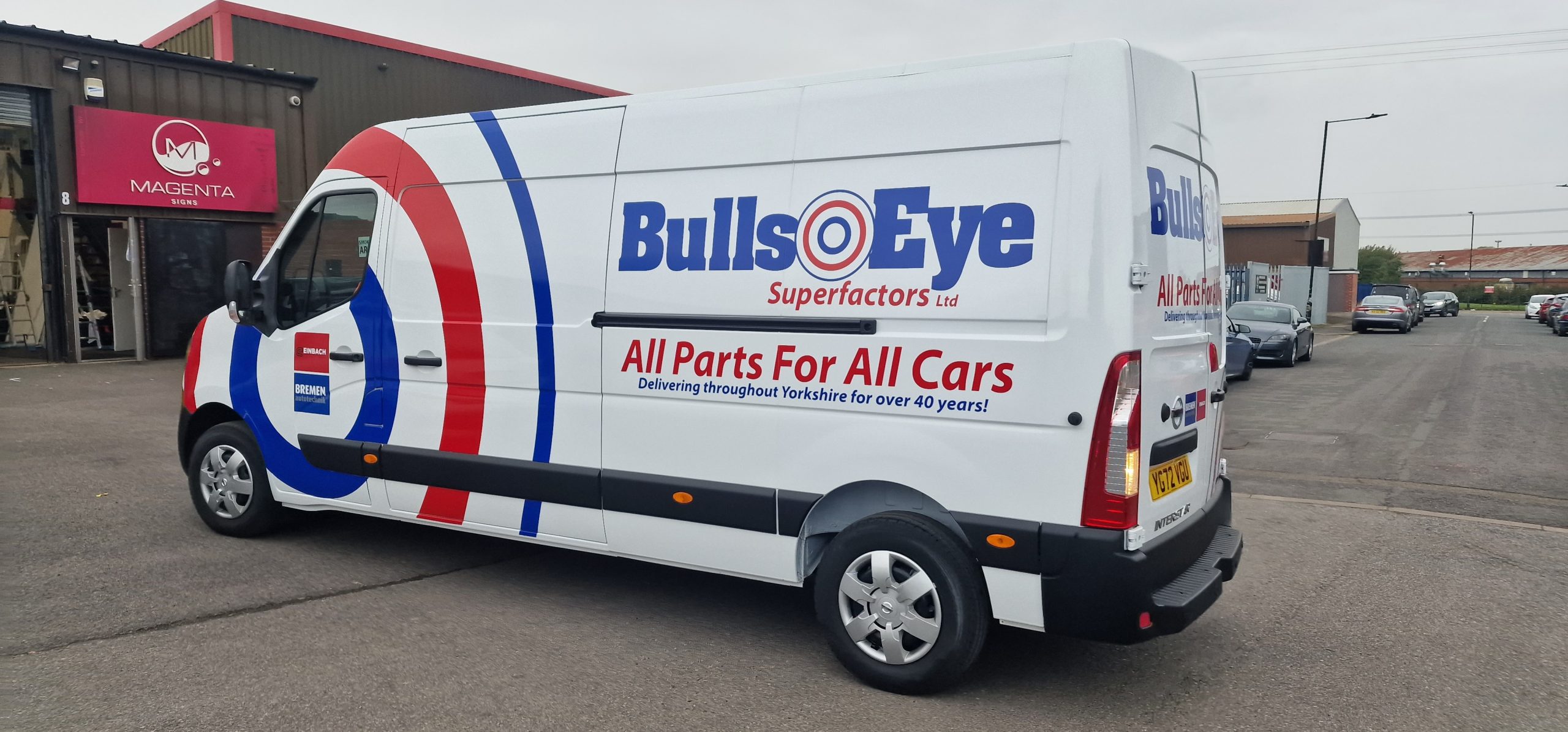 Commercial van displaying finished vehicle signage at the Magenta Signs workshop.